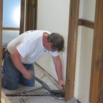 Securing the Carpet in the hallway.