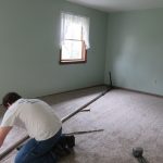 Stretching the Carpet to keep it tight during use.